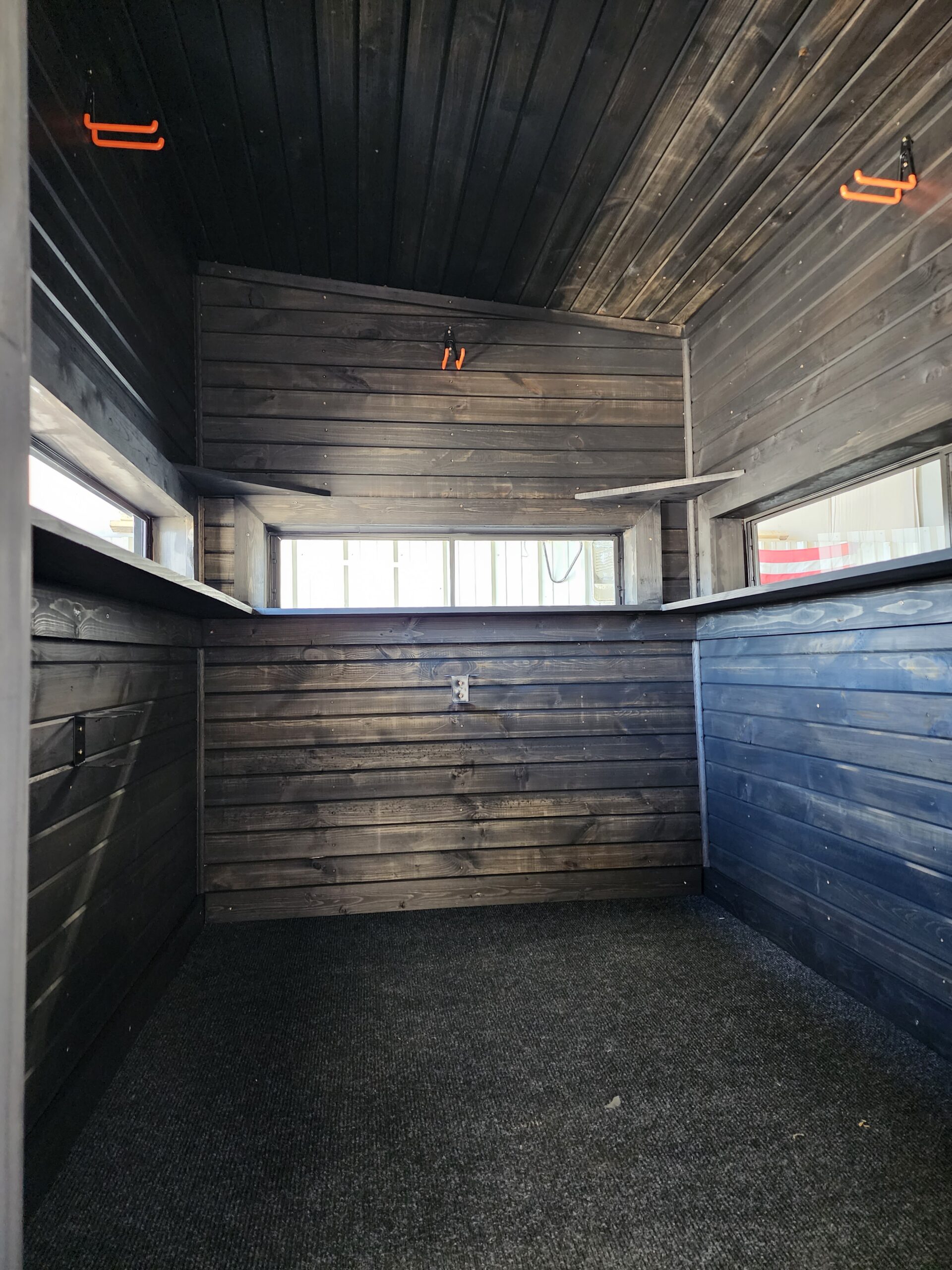 interior of deer stand with wood paneling