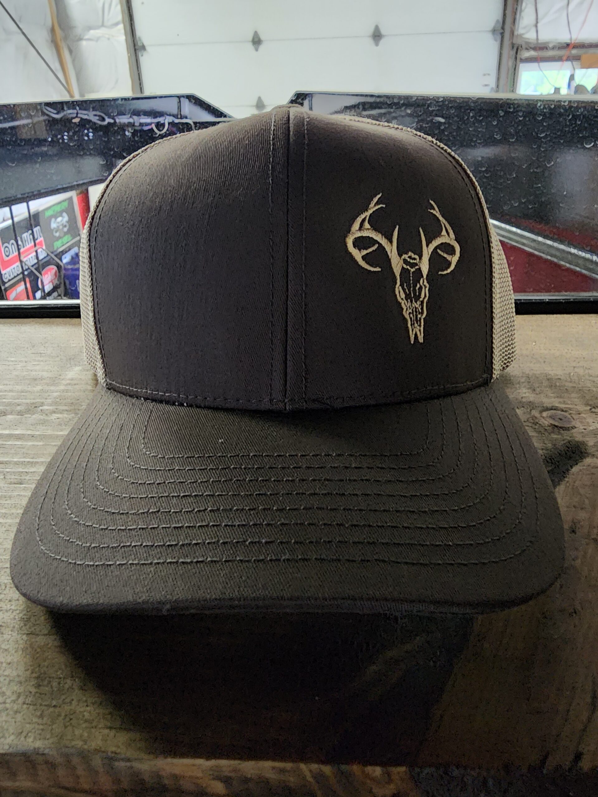 brown hat with deer skull