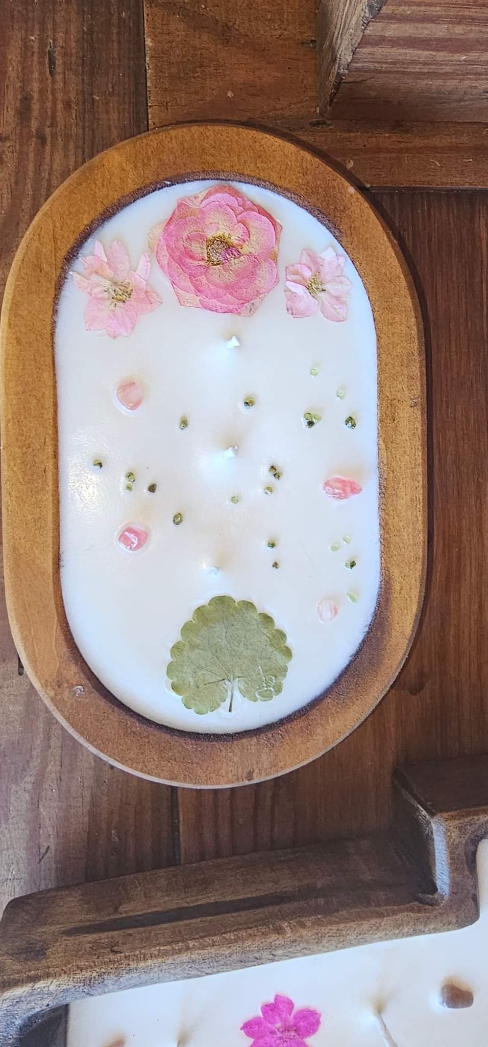 candle in wooden dish